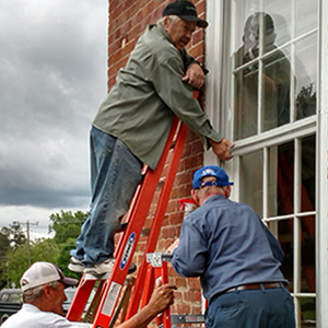 cleaning windows at Salem presbyterian church