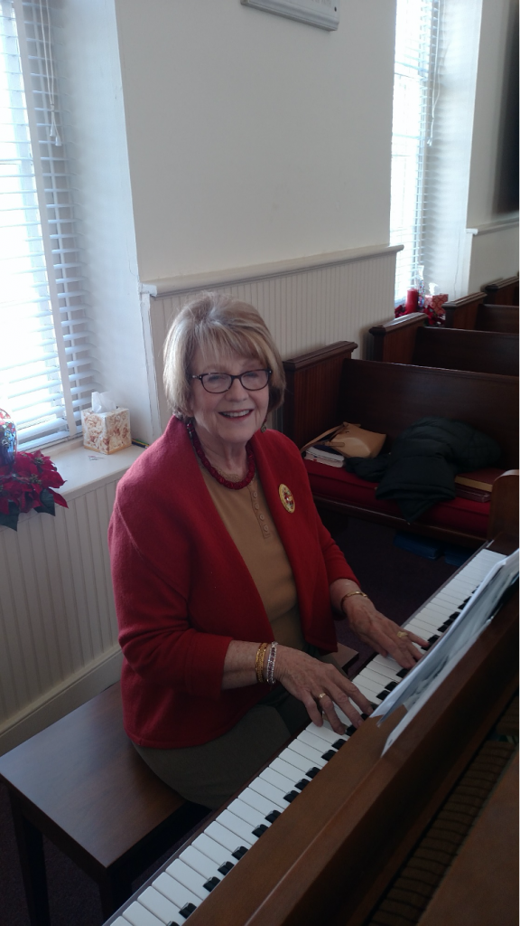 plalying piano at church in studley